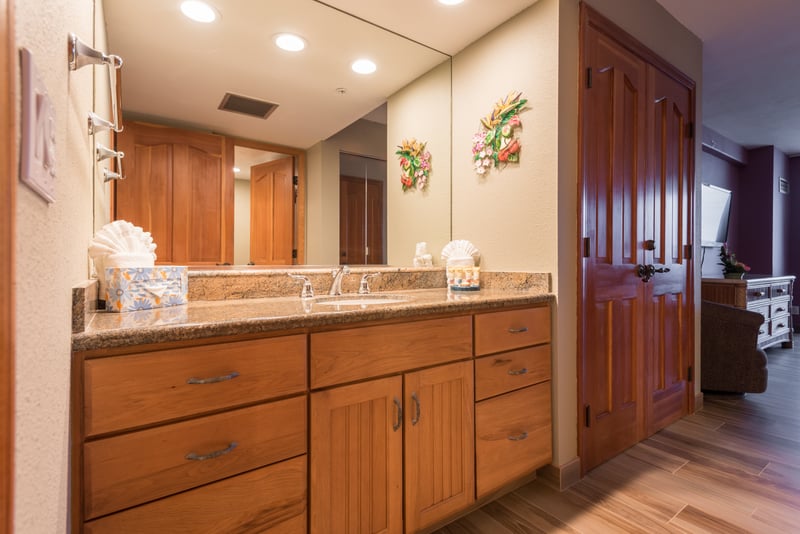 Where form meets function in harmony, this master bath blends smart storage with classic wood elegance
