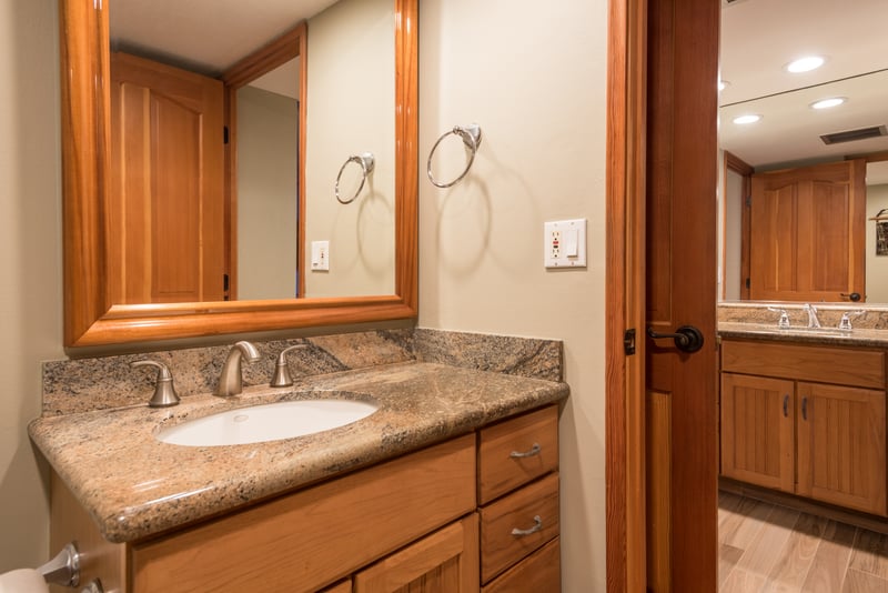 From the curved faucet to the graceful mirror frame, this bathroom is a quiet ode to timeless warmth and care