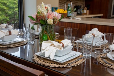 A curated stillness lingers where culinary rituals become sacred, framed by verdant vistas and soft-spoken design poetry