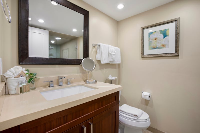 Pamper yourself in a serene, spa-like bathroom featuring a sleek vanity with ample counter space and modern fixtures MAH-611