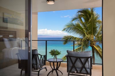 Start your mornings with coffee and an ocean breeze on this private lanai, where paradise is just a glance away