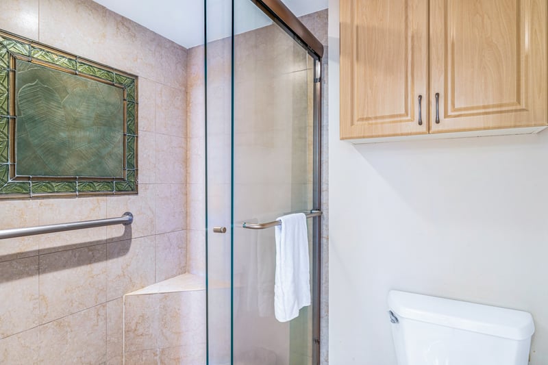 The bathroom features a glass walk in shower for comfort MAH-814