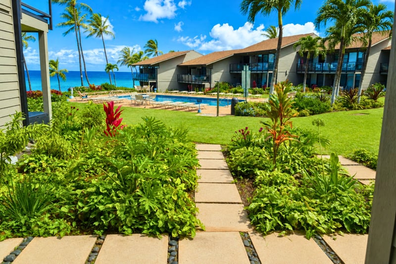 Your private lanai looks out to a beautiful garden, framed by the ocean and poolside views.