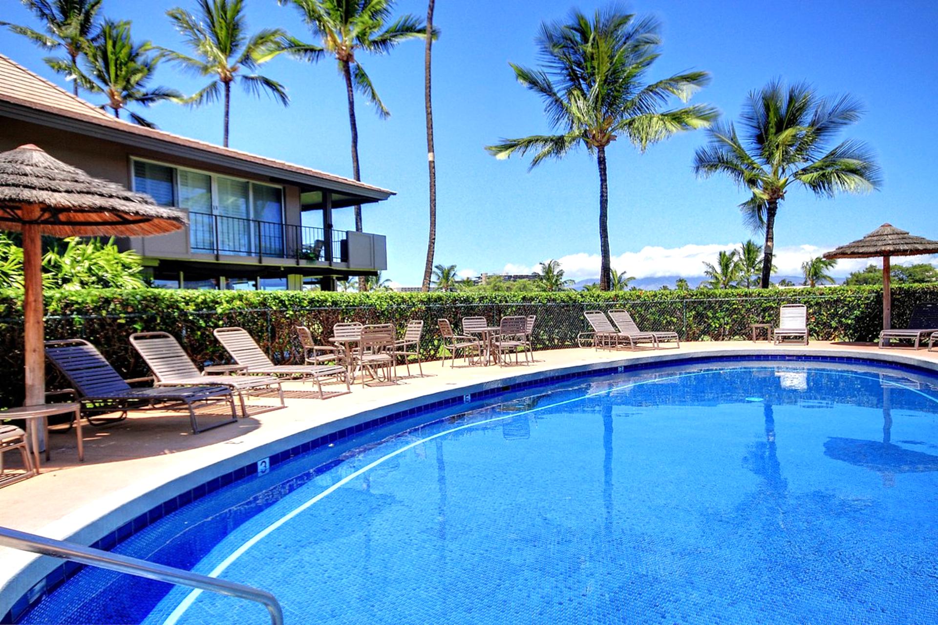 Take a refreshing swim or unwind poolside under a thatched umbrella, surrounded by tropical landscaping and island sun.