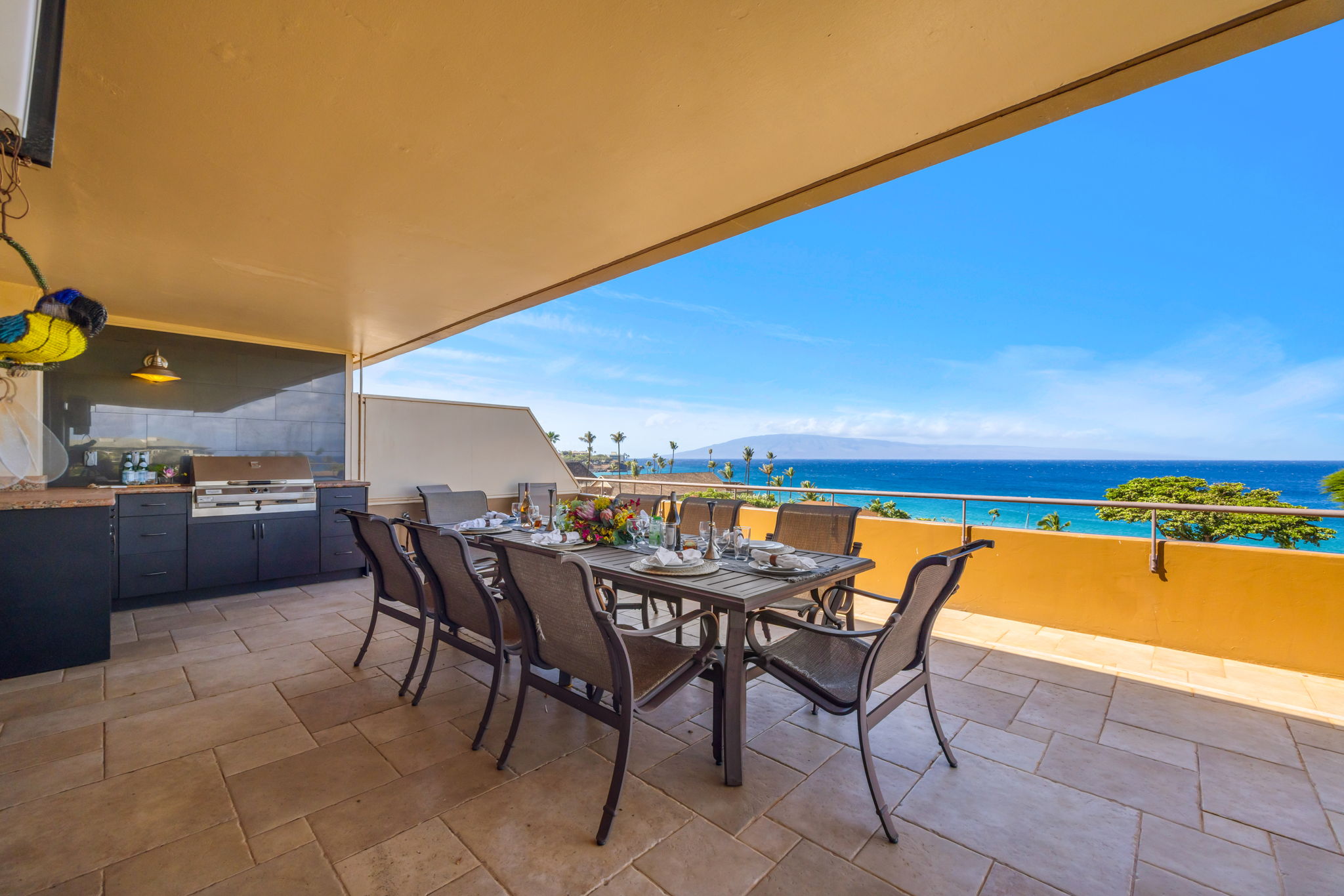 Covered lanai seating offers shade and uninterrupted ocean views for lounging or sunset cocktails.
