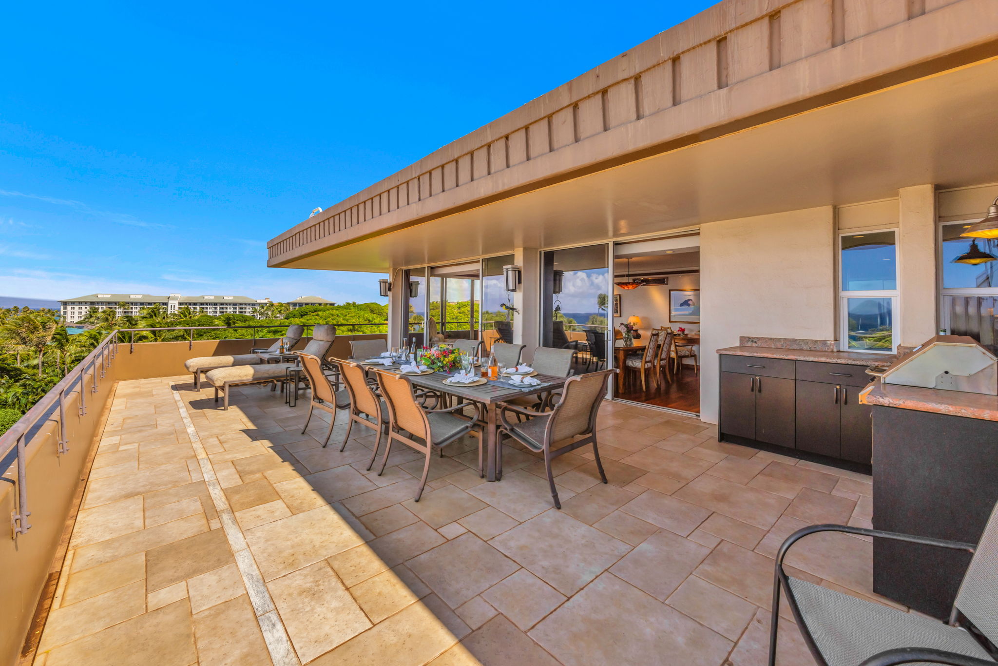 Enjoy morning coffee or afternoon drinks on your elevated lanai with direct beach views.