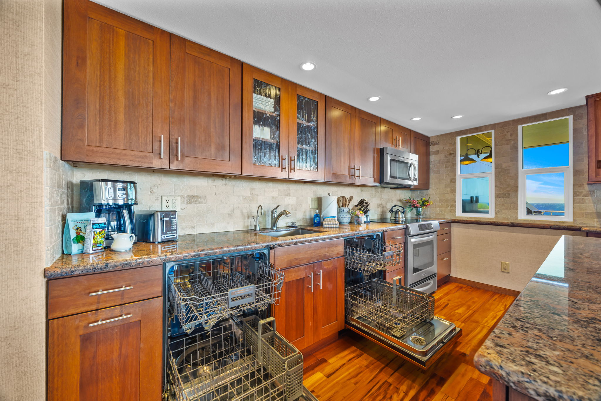 Double dishwashers and a glass cooktop make in-condo meals feel like a breeze