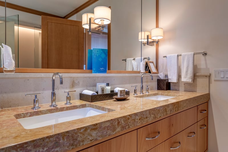 Bathed in honey-hued wood and wrapped in marble, this room is where elegance and comfort shake hands