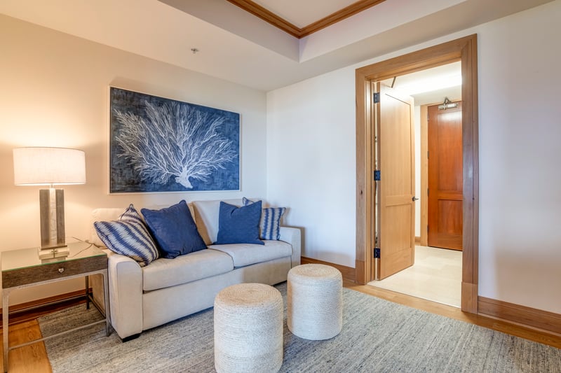  A cozy corner of the guest suite, where soft textures, ocean hues, and gentle light invite quiet moments of retreat   MON-6401