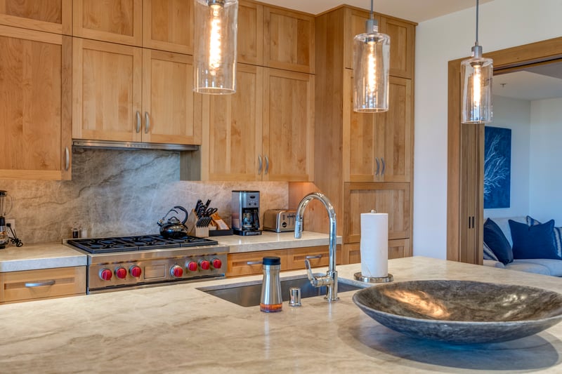 This kitchen glows like a warm croissant—golden, crisp, and ready to be filled with delicious adventures