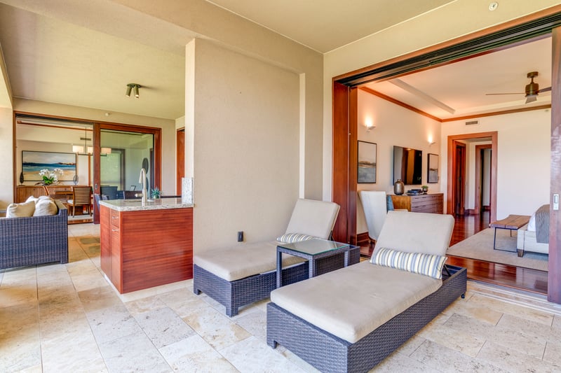 Step into a realm where sunrise spills across fine linens, and tranquility begins at the open lanai doors    