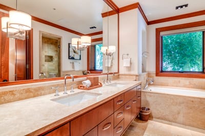 This guest bath is a retreat of soft light, artisan finishes, and calm—crafted for quiet indulgence each day