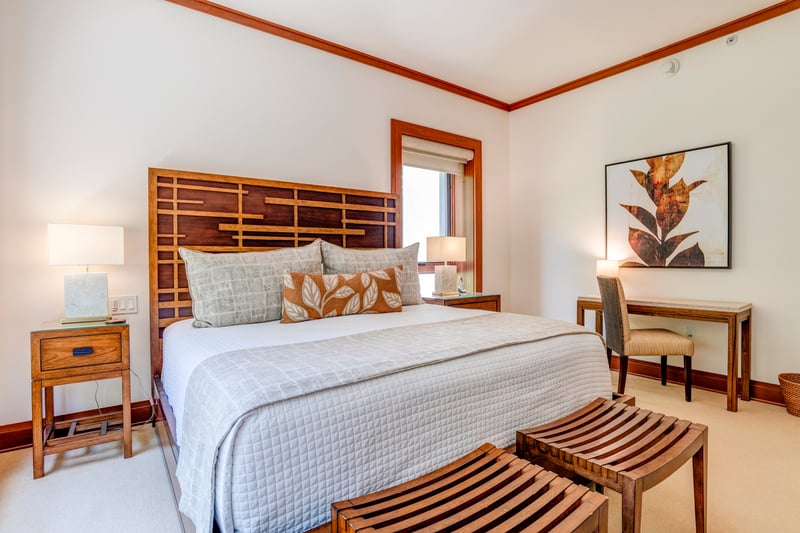 Sleek wood tones and soft neutrals meet in harmony, offering restful sophistication in every detail    