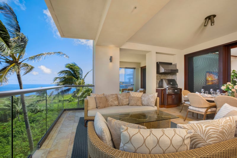 A lanai designed for dreamers—chic lounges, whispering palms, and views that stretch into infinite shades of blue   