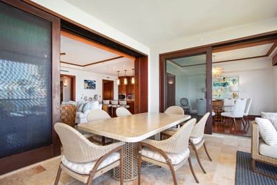 Seamless indoor-outdoor living at its finest—enjoy open-air dining steps from the kitchen and coastal comforts