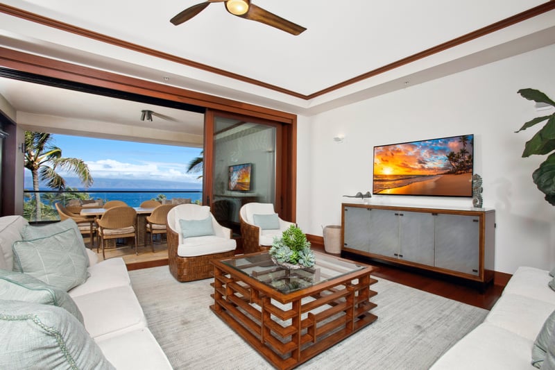 Sink into cloud-white sofas while seashell art smiles down and island breezes gossip through the wide glass doors   