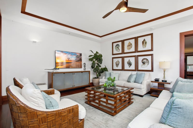   A place where the couch calls your name, the ceiling fan dances, and shell art cheers you on in beachy style 