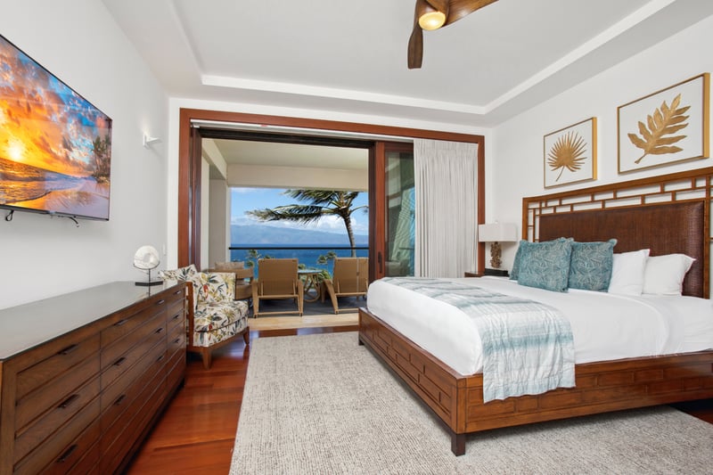 Sliding doors open to a breezy balcony retreat, furnished with woven loungers perfectly placed for sunrise reverie   