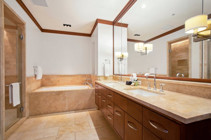Bathed in honey-hued wood and wrapped in marble, this room is where elegance and comfort shake hands  