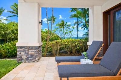 Plush outdoor loungers line your private lanai, offering front row seats to swaying palms and sparkling Pacific views. MON-2204