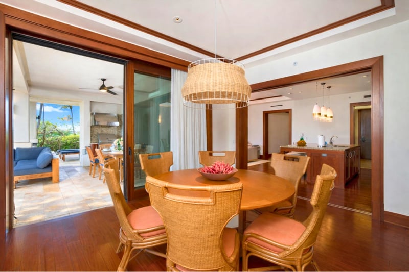 Floor to ceiling glass doors connect your dining area to the lanai, blending indoor comfort with outdoor beauty. MON-2204