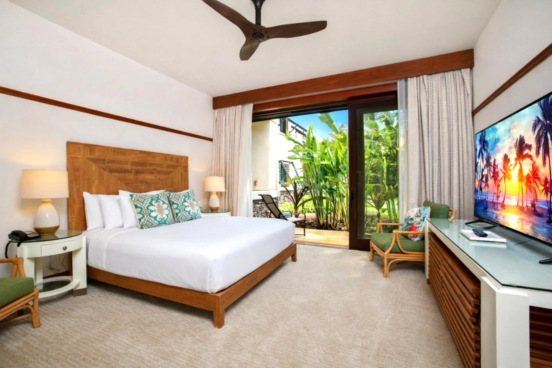 Just off your bedroom, a cozy sitting area with desk and lanai access offers a quiet place to plan the day.