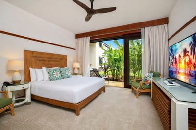 Just off your bedroom, a cozy sitting area with desk and lanai access offers a quiet place to plan the day. MON-2204