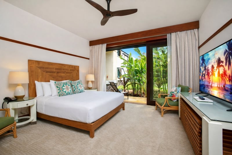 Just off your bedroom, a cozy sitting area with desk and lanai access offers a quiet place to plan the day. MON-2204