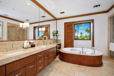 In your Master Bath, a walk in shower and deep soaking tub are complemented by dual vanities and warm wood cabinetry. MON-2204