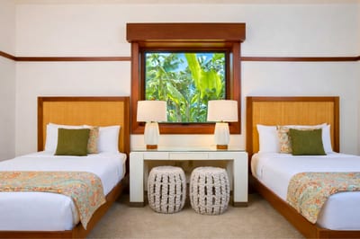 Two beds and a ceiling fan make this guest bedroom comfortable for family or friends traveling together. MON-2204