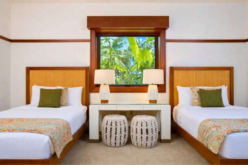Two beds and a ceiling fan make this guest bedroom comfortable for family or friends traveling together. MON-2204