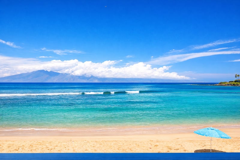 Endless blue horizons and the silhouette of Moloka'i in the distance.