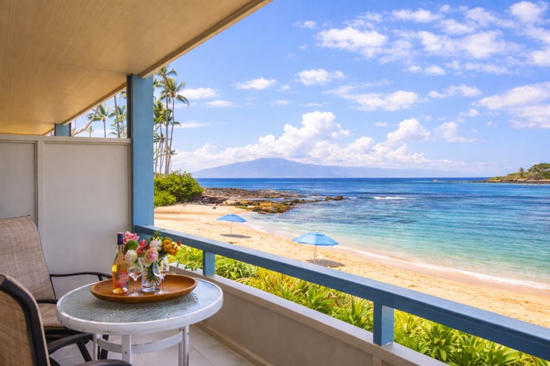 An outdoor dining nook designed for whale watching and sea breezes.