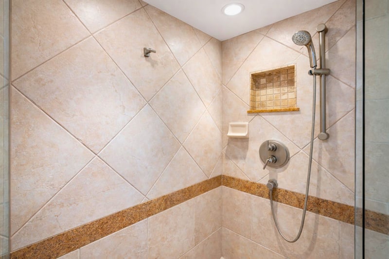 Clean, updated walk-in shower with premium finishes.