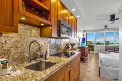 Granite countertops and a breakfast bar for casual morning meals.