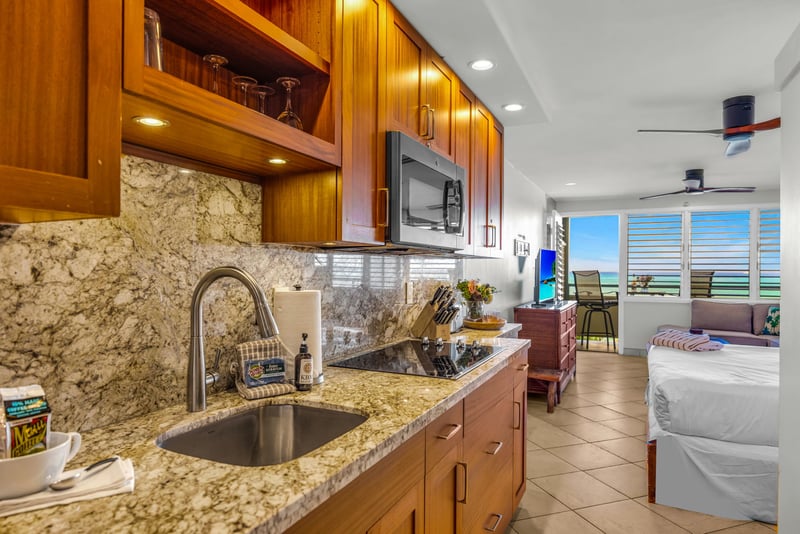 Granite countertops and a breakfast bar for casual morning meals.