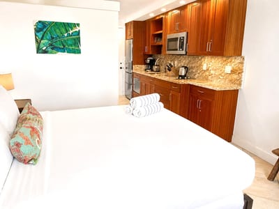 Island-inspired accents and plush linens create a peaceful sanctuary.