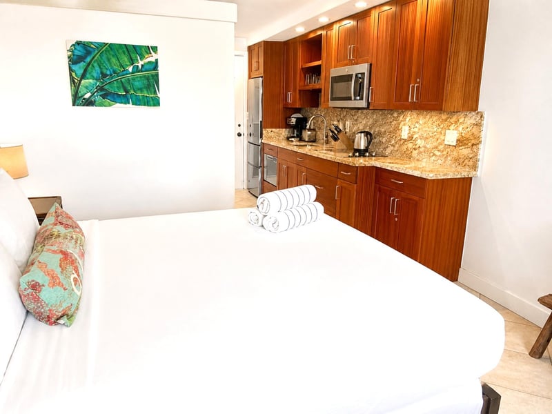 Island-inspired accents and plush linens create a peaceful sanctuary.