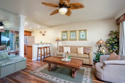 Where pineapple lamps glow and soft cushions await, unwind in a space curated for comfort, charm, and cheer NAP-A25