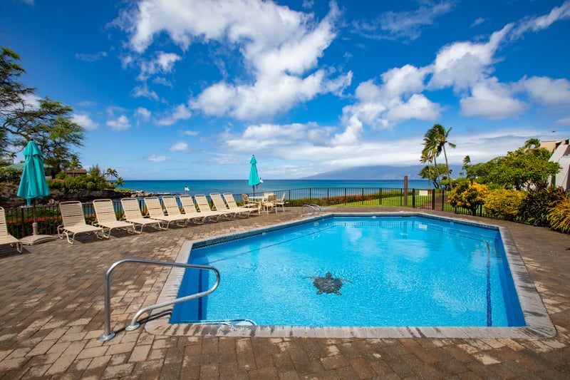 Where poolside calm meets patio bliss—relax in island elegance, just moments from the shoreline NAP-A25