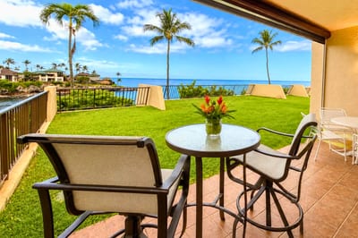 Relax on your private lanai overlooking the perfectly manicured lawn and Napili Bay