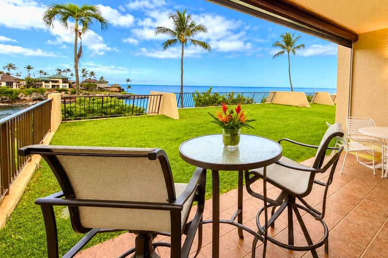 Relax on your private lanai overlooking the perfectly manicured lawn and Napili Bay
