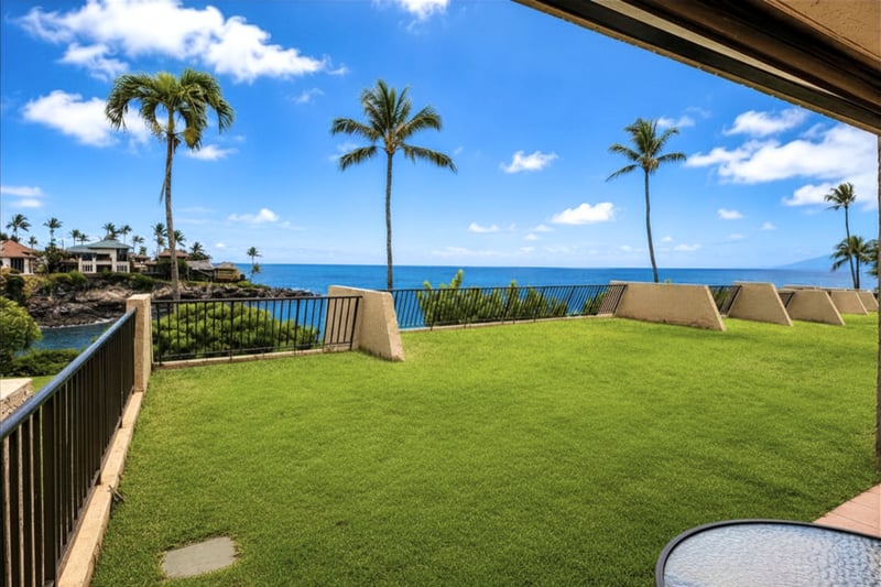 Expansive ocean views stretch beyond Honokeana Bay from beautifully manicured grounds