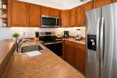 Chef's kitchen at Napili Point B31 — full-size range, microwave, coffee maker, and blender for effortless island cooking