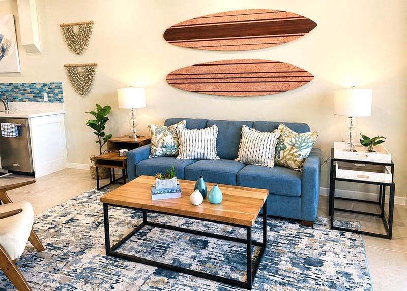 Another view of the living area highlights the coastal artwork and open, relaxed layout
