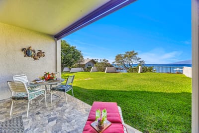 Relax on the patio while soaking in peaceful green space NAP-B42