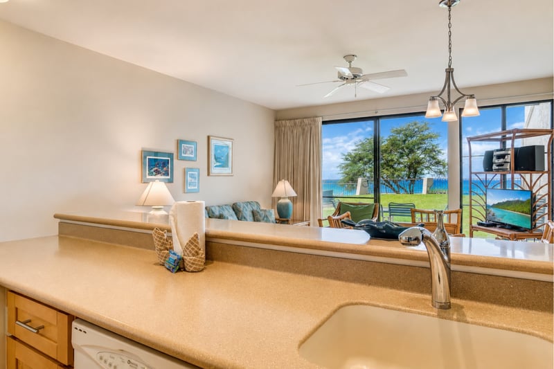 Even the chef gets an ocean view! The seamless flow from the kitchen to the lanai ensures you never miss a moment of island beauty.