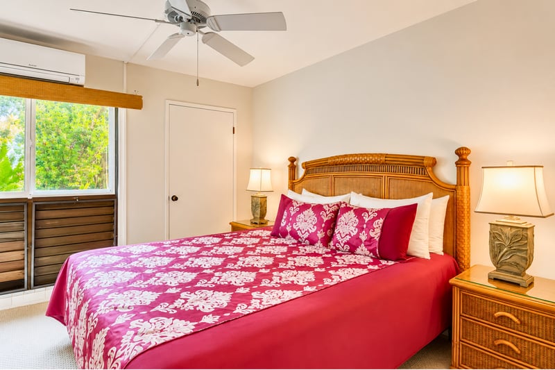 Fall asleep to the gentle sound of the ocean waves in the comfortable master bedroom, beautifully accented with tropical decor.