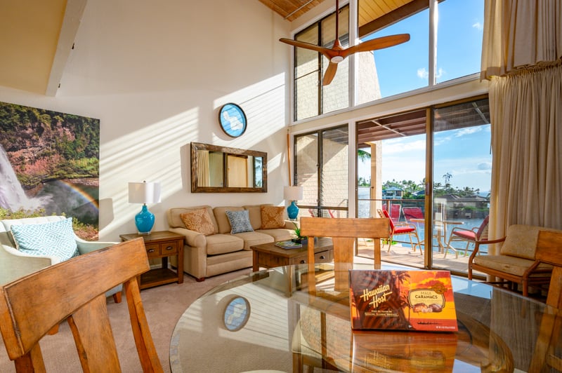 This sunny dining space offers lofted ceilings, modern tropical décor, and a cozy spot to enjoy meals and moments NAP-C18