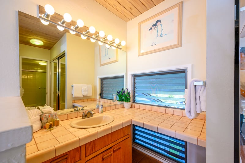 A glowing vanity mirror framed with classic Hollywood bulbs brings vintage charm to your daily rituals and evening unwind NAP-C18